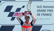 Repsol Honda Team's Marc Marquez celebrates with a trophy after winning the race. Reuters/Gonzalo Fuentes