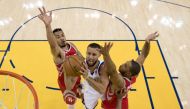 Golden State Warriors guard Stephen Curry (30) shoots the basketball against Houston Rockets guard Gerald Green (14) and guard Eric Gordon (10) during the first half in game three of the Western conference finals of the 2018 NBA Playoffs at Oracle Arena. 