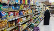 FILE PHOTO: A woman shops in a supermarket in Doha, Qatar June 7, 2017. REUTERS/Stringer