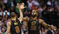 BOSTON: LeBron James #23 of the Cleveland Cavaliers celebrates with George Hill #3 in the second half against the Boston Celtics during Game Seven of the 2018 NBA Eastern Conference Finals at TD Garden on May 27, 2018 in Boston, Massachusetts. Maddie Meye