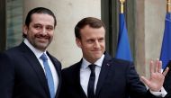 File photo: French President Emmanuel Macron and Saad al-Hariri react on the steps of the Elysee Palace in Paris, France, November 18, 2017. Reuters/Benoit Tessier/File Photo