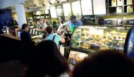 A Starbucks employee gives change to a patron in a Center City store, before more than 8,000 branches nationwide will close this afternoon for anti-bias training, in Philadelphia, Pennsylvania U.S., May 29, 2018. Reuters/Mark Makela