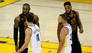 LeBron James #23 and Tristan Thompson #13 of the Cleveland Cavaliers exchange words with Klay Thompson #11 and Stephen Curry #30 of the Golden State Warriors in overtime during Game 1 of the 2018 NBA Finals at ORACLE Arena on May 31, 2018 in Oakland, Cali