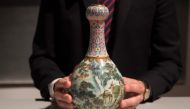 (FILES) In this file photo taken on May 22, 2018 a rare Imperial Qianlong porcelain vase (18th century) is displayed at Sotheby's auction company in Paris. AFP / Thomas SAMSON