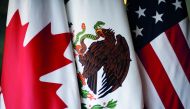 FILE PHOTO: Flags are pictured during NAFTA talks involving the United States, Mexico and Canada, in Mexico City, Mexico, November 19, 2017. Reuters/Edgard Garrido