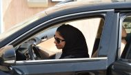 Saudi Majdoleen Mohammed Alateeq, a newly-licensed Saudi driver, prepares for driving her car near her home in the Saudi capital of Riyadh, on June 24, 2018.  AFP / Fayez Nureldine
