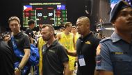 In this photo taken July 2, 2018, Australian players and officials leave the court after their FIBA World Cup Asian qualifier game against the Philippines, at the Philippine arena in Bocaue town, Bulacan province, north of Manila. / AFP / TED ALJIBE