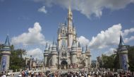 Visitors watch a performance at the Cinderella Castle at the Walt Disney Co. Magic Kingdom park in Orlando, Florida, on Sept. 12, 2017. Bloomberg photo by David Ryder.
