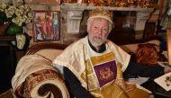 Paul Delprat, 76, posing for a photo at his home as the self-appointed Prince of the Principality of Wy, a micronation spanning his home in the north Sydney suburb of Mosman. AFP / Peter Parks