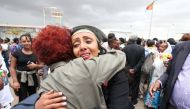 Relatives embrace after meeting at Asmara International Airport, after one arrived aboard the Ethiopian Airlines ET314 flight in Asmara, Eritrea July 18, 2018. Reuters/Tiksa Negeri