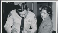 Rosa Parks being fingerprinted by a deputy sheriff  after being arrested for boycotting public transportation, Montgomery, Alabama, February, 1956.