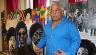 Seattle Black Panthers Party co-founder Elmer Dixon poses for a photograph in front of a commemorative mural, April 27, 2018. Thomson Reuters Foundation/Gregory Scruggs