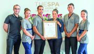 The team which offers spa service at Souq Waqif Boutique Hotels by Tivoli with the award. 