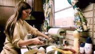 Housewife in the kitchen of her mobile home in one of the trailer parks Photo coutesy: Horacia Villalobos/Environmental Protection Agency's Documerica project in the early 1970s. 