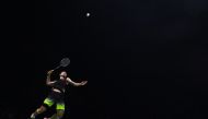 Shi Yuqi of China hits a shot against Chen long of China in their men's singles semi-final match during the badminton World Championships in Nanjing, Jiangsu province on August 4, 2018. / AFP / Johannes EISELE