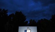 In this file photo taken on March 21, 2018 a lit ‘Like’ sign is seen at the entrance to Facebook's corporate headquarters location in Menlo Park, California on March 21, 2018.  AFP / Josh Edelson
 