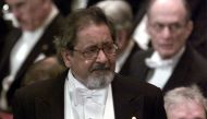 Writer V.S. Naipaul waits to receive his Nobel prize for literature at Stockholm's Konserthuset from Sweden's King Carl Gustaf, Sweden December 10, 2001. (REUTERS/Chris Helgren/File Photo)