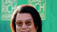 Author Kevin Kwan poses at the premiere for 