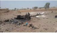 A grab taken from a AFPTV video on August 25, 2018 shows wreckage of a car hit by the strike in Al-Durayhimi, some 20 kilometers (12 miles) south of Hodeida, after a missile strike for which the Huthi rebels and a Saudi-led coalition fighting them traded 