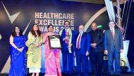 Dr Azad Moopen  (centre) receiving the Lifetime Achievement Award at FICCI Healthcare Excellence Awards.