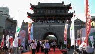 This photo taken on August 5, 2018, shows players arriving on the red carpet during the opening of the 2018 Yushan World Open snooker tournament in Shangrao in Yushan county, China's central Jiangxi province. 