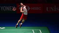 Japan's Kento Momota prepares to smash against Thailand's Khosit Phetpradab during the men's singles final at the Japan Open Badminton Championships in Tokyo on September 16, 2018. (AFP / JIJI PRESS)