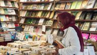 A customer browses books at a bookshop in the Moroccan capital Rabat on August 9, 2018. AFP / FADEL SENNA
 