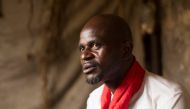 Juju priest David Ubebe poses for a photo in his shrine in Benin, Nigeria, July 1, 2018. Thomson Reuters Foundation/Kagho Idhebor