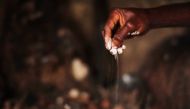 Hand of juju priest David Ubebe during a juju ceremony in his shrine in Benin, Nigeria, July 1, 2018. Thomson Reuters Foundation/Kagho Idhebor 