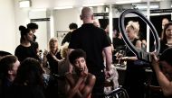 Models wait in the backstage prior to the presentation of Marco De Vincenzo fashion house, during the Women's Spring/Summer 2019 fashion shows in Milan, on September 21, 2018. AFP / Marco Bertorello