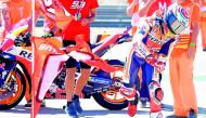 Repsol Honda Team's Spanish rider Marc Marquez celebrates with supporters after winning the MotoGP race of the Moto Grand Prix of Aragon at the Motorland circuit in Alcaniz on September 23, 2018. AFP / Jose Jordan 