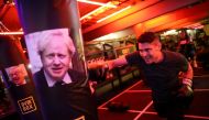 A gym member punches a boxing bag containing an image of Britain's former Foreign Secretary Boris Johnson during a Brexfit gym class at Gym Box in London, Britain September 27, 2018. Picture taken September 27, 2018. REUTERS/Simon Dawson