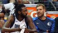 DeAndre Jordan #6 and Dirk Nowitzki #41 of the Dallas Mavericks talk on the bench during a preseason game against the Beijing Ducks at American Airlines Center on September 29, 2018 in Dallas, Texas. Richard Rodriguez/AFP
