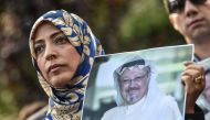 Nobel Peace Prize laureate Yemeni Tawakkol Karman holds a picture of missing journalist Jamal Khashoggi during a demonstration in front of the Saudi Arabian consulate, on October 5, 2018 in Istanbul.  AFP / Ozan Kose
 