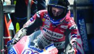 Ducati Team's Italian rider Andrea Dovizioso enters the pit during the free practice session of Thailand's inaugural MotoGP at Buriram International Circuit in Buriram on October 5, 2018. AFP / Lillian Suwanrumpha

