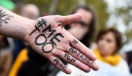 #MeToo on the hand of a protester during a gathering called by the Effronte-e-s Collective on the Place de la Republique square in Paris on October 29, 2017. AFP/Bertrand Guay