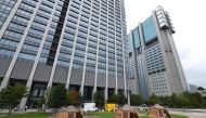 This photo taken on September 11, 2018 shows company employees working inside camping tents erected on the lawn outside an office building in Tokyo. AFP / Toshifumi Kitamura 