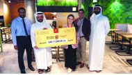 McDonald’s Qatar hands over ‘Big Mac Big Cause’ cheque to Mohammed Mubarak Al Hajri, Head of General Resource Mobilization, Qatar Red Crescent.