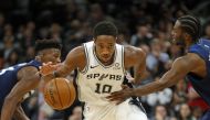 DeMar DeRozan #10 of the San Antonio Spurs is fouled by Andrew Wiggins #22 of the Minnesota Timberwolves in closing seconds in season opener at AT&T Center on October 17 , 2018 in San Antonio, Texas.   Ronald Cortes//AFP