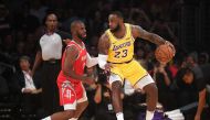 LeBron James #23 of the Los Angeles Lakers dribbles the ball against Chris Paul #3 of the Houston Rockets during the first quarter at Staples Center on October 20, 2018 in Los Angeles, California. Harry How/AFP
