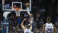 Russell Westbrook #0 of the Oklahoma City Thunder goes over Nemanja Bjelica #88 of the Sacramento Kings for two points during the second half of a NBA game at the Chesapeake Energy Arena on October 21, 2018 in Oklahoma City, Oklahoma. J Pat Carter/AFP