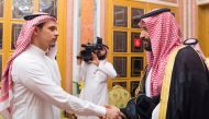 Salah Khashoggi shakes hands with Crown Prince Mohammed bin Salman after being 'invited' to receive condolences (Photo: Saudi Press Agency) 
