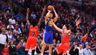 Golden State Warriors guard Klay Thompson (11) shoots the ball against Chicago Bulls forward Justin Holiday (7) and guard Zach LaVine (8) during the second half at the United Center. Mike DiNovo