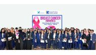 Doha Bank employees and officials at the breast cancer awareness campaign.