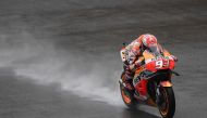 Repsol Honda Team's Spanish rider Marc Marquez rides on the rain-hit track during the qualifying session of the Malaysia MotoGP at the Sepang International circuit in Sepang on November 3, 2018. / AFP / Mohd RASFAN