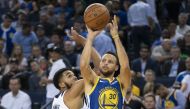 Golden State Warriors guard Stephen Curry (30) shoots the basketball against Minnesota Timberwolves centre Karl-Anthony Towns (32) during the fourth quarter at Oracle Arena. Kyle Terada 