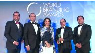 Ashraf Ali MA, Executive Director of Lulu Group; Adeeb Ahamed, MD of Lulu Financial Group; Shafeena Yusuffali, CEO of Tablez; Mohammed Althaf, Director; and V Nandakumar, CCO of Lulu Group, with the Brand of The Year Trophy at the World Branding Awards ce