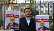 FILE PHOTO: People protest against the killing of journalist Jamal Khashoggi in Turkey outside the Saudi Arabian Embassy in London, Britain, October 26 2018. REUTERS/Simon Dawson/File Photo