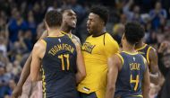 November 24, 2018; Oakland, CA, USA; Golden State Warriors guard Klay Thompson (11) is congratulated by forward Kevon Looney (5), forward Jordan Bell (2), and guard Quinn Cook (4) after making the game-winning basket against the Sacramento Kings during th