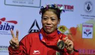 Mary Kom of India gestures with her gold medal after winning the 45-48 kg category final fight at the 2018 AIBA Women's World Boxing Championships in New Delhi on November 24, 2018. (AFP / Sajjad HUSSAIN)